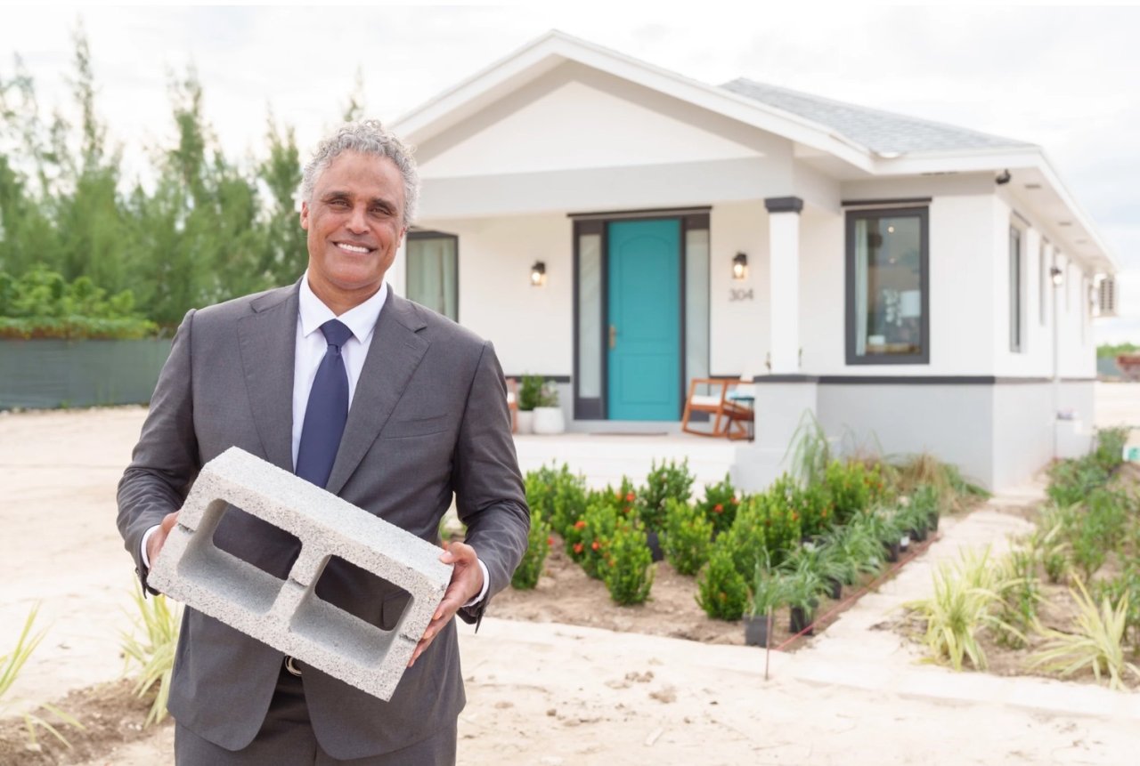Rick Fox holding Partanna block outside Partanna Home.